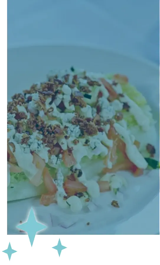A vertical image of a plate of pasta with stars around it.